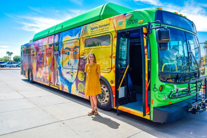 Sydney Storment pictured next to her bus