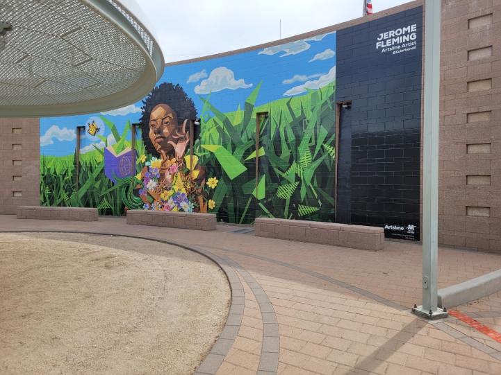 Artsline Spotlight artist's work of girl reading a book at Roosevelt/Central Ave station