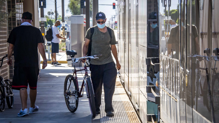 Bicyclist on light rail platform