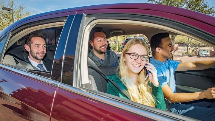 Carpoolers smiling.