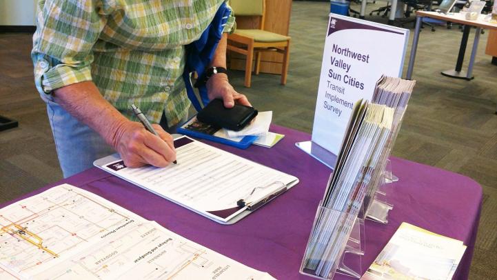 Sun City woman completing a paper survey as part of the Existing Conditions phase.