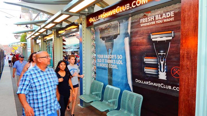 rider looks at station advertising