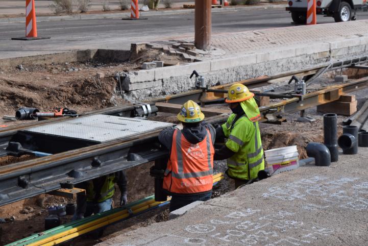 Workers install special trackwork in March 2021