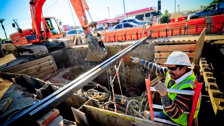 Crews work on installing new light rail track