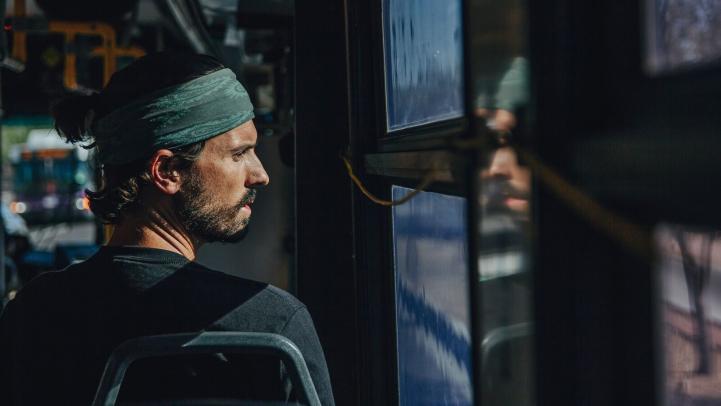 A Valley Metro bus rider keeps cool in a bus on a hot day