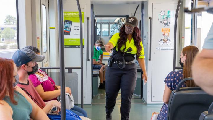 A Customer Experience Coordinator on a light rail train
