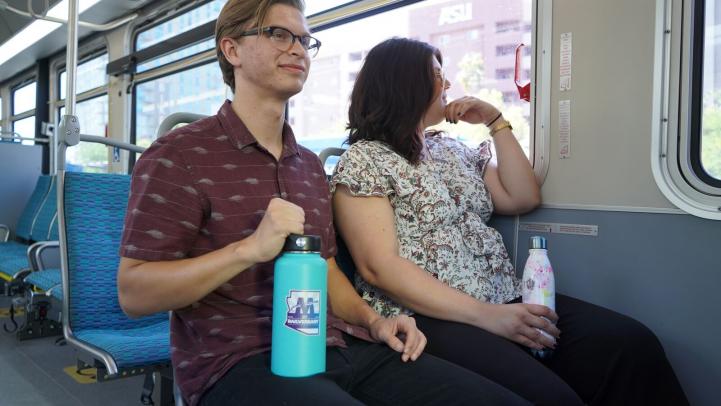 Passengers using appropriate water bottles during their trip