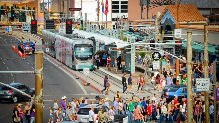 Picture of light rail train on crowded day downtown